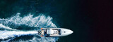 Aerial drone ultra wide photo of luxury inflatable speed boat cruising deep blue Aegean sea, Greece