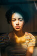 © Inti St. Clair - Portrait of pretty teen girl with curly hair in mixed light
