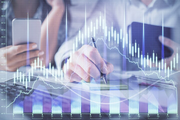 Double exposure of man and woman working together and financial graph hologram. Business concept. Computer background.