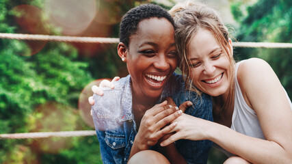 cheerful girls embracing each other