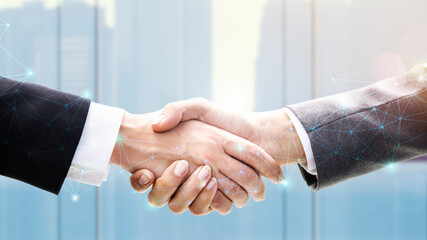 Business people shaking hands in agreement