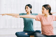 © Timeimage - Two Asian women are practicing meditation at home