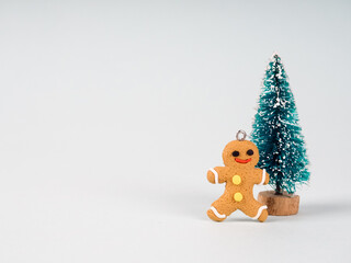 Gingerbread man and a small Christmas tree. traditional Christmas dessert cookies