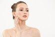 © Alena - Portrait of a beautiful young woman with clean skin and makeup on a white background