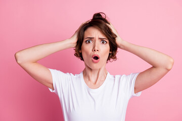 Poster - Close-up portrait of lovely messy puzzled nervous brown-haired girl bad news reaction pou lips isolated over pink color background