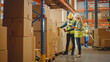 © Gorodenkoff - Retail Warehouse full of Shelves with Goods in Cardboard Boxes, Male Worker and Female Supervisor Holding Digital Tablet Discuss Product Delivery while Scanning Packages.Distribution Logistics Center