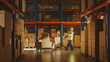 © Gorodenkoff - Worker Moves Cardboard Boxes using Hand Pallet Truck, Walking between Rows of Shelves with Goods in Retail Warehouse. People Work in Product Distribution Logistics Center. Side View Shot