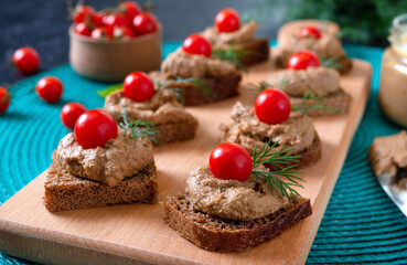 Wall Mural - Canapes with rye bread, liver pate, cherry tomatoes. Breakfast snack.