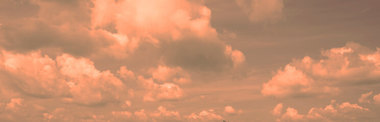 Wall Mural - toned cloudscape. blue gray sky with orange pink clouds. dramatic sky background.