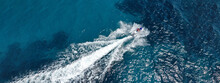 Aerial Drone Ultra Wide Photo Of Jet Ski Watercraft Cruising In High Speed In Deep Blue Open Ocean Sea