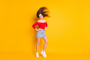 Wall Mural - Full length body size view of her she nice attractive fashionable thin slender cheerful teen girl throwing healthy hair having fun isolated over bright vivid shine vibrant yellow color background