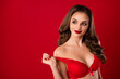 © deagreez - Photo portrait of dreamy girl taking off brassiere isolated on vivid red colored background with blank space