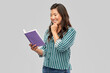 © Syda Productions - people, ethnicity and portrait concept - happy asian young woman reading book over grey background