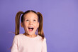 © deagreez - Photo of amazed pretty little girl wear sweatshirt look up empty space isolated on purple color background