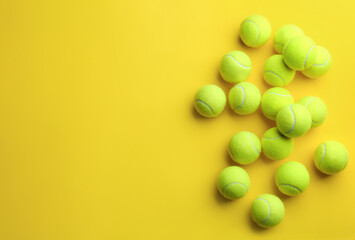 Wall Mural - Tennis balls on yellow background, flat lay. Space for text