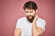 © SHOTPRIME STUDIO - emotional man white t shirt sad facial expression pink background