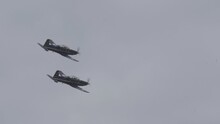 Slow Motion Of A Formation Of Harvard II Turboprop Trainers Performing Maneuvers During An Air Show.