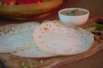 Wall Mural - Rice pancake or Hoppers locally called Appam served with Chicken and potatoes simmered in coconut milk 