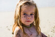 © Mint Images - portrait of 3 year old girl at the beach