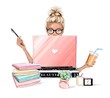 Beautiful blonde hair woman working on laptop computer. Pretty girl sitting at table, holding plastic coffee cup and using pen. Table with flowers, planners, clock, pens.