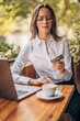 © eastwest photo - businesswoman working in cafe