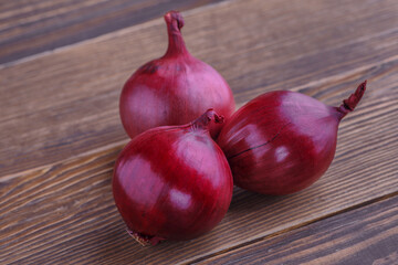 red onions on rustic wood