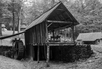 Poster - SIBIU, ROMANIA - Oct 04, 2020: an old water mill at the Village Museum in Sibiu - Romania