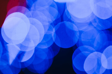 Bokeh, blurry city lights. Beautiful blurred abstract background with blue circles