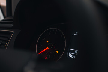 Poster - Closeup shot of a car speedometer on dark background