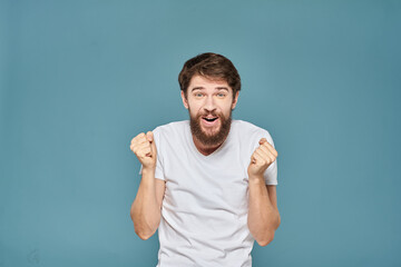 man in white t-shirt gesturing with his hands studio cropped