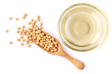 Wall Mural - Soy bean oil in glass bowl and soybean in wooden spoon isolated on white background. Top view. Flat lay.