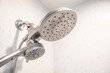 DENVER, COLORADO, UNITED STATES - Oct 12, 2020: A silver shower head in a white modern shower