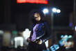 © VERSUSstudio - Black  girl portrait in night city lights