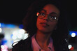 © VERSUSstudio - Black  girl portrait in night city lights