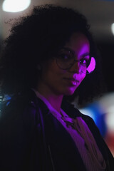 Black  girl portrait in night city lights