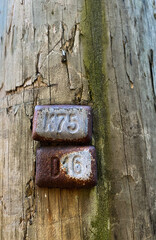 old sign on a wood pole