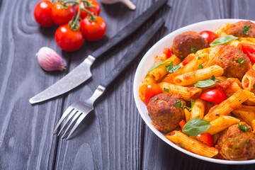 Canvas Print - Italian penne pasta with meatballs and tomatoes