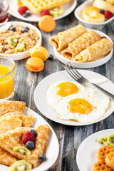 Wall Mural - Breakfast - fried eggs, pancakes, crepes, croissants