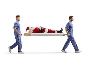 Wall Mural - Two male health workers carrying Santa Claus on a stretcher