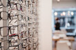 Selective focus shot of a row of glasses on display at an optics store