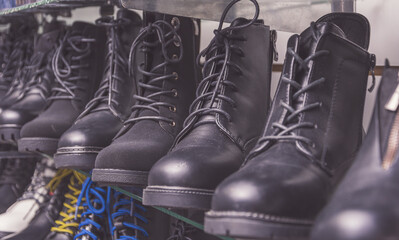 Wall Mural - Closeup of a collection of boots in a men's shoes store