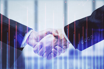 Double exposure of forex graph hologram and handshake of two men. Stock market concept.