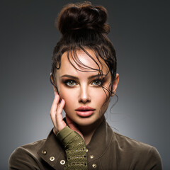 Wall Mural - closeup portrait of a beautiful young fashion woman with glamour makeup posing at studio.