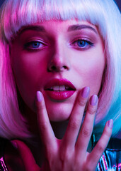 Wall Mural - Glamour fashion girl. Beauty face with bright makeup. Young beautiful woman in a white wig, bob hairstyle. Close up art portrait  of  an young attractive woman with vivid colors. Stylish blonde.