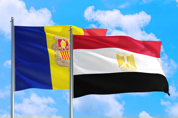 Egypt and Andorra national flag waving in the windy deep blue sky. Diplomacy and international relations concept.