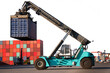 blue reach stacker transport cargo container parking with clipping path, Container commercial port, Logistics and transportation of Container Cargo and Cargo logistic import export background and tran