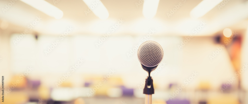 Public speaking backgrounds, Close-up the microphone on stand for speaker speech at seminar room with blur bokeh background. - obrazy, fototapety, plakaty 