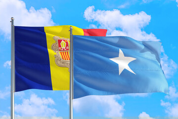 Somalia and Andorra national flag waving in the windy deep blue sky. Diplomacy and international relations concept.