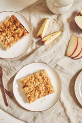 Wall Mural - Top view of delicious homemade apple cake with crumble on a white table