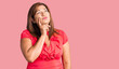 © Krakenimages.com - Middle age latin woman wearing casual clothes serious face thinking about question with hand on chin, thoughtful about confusing idea